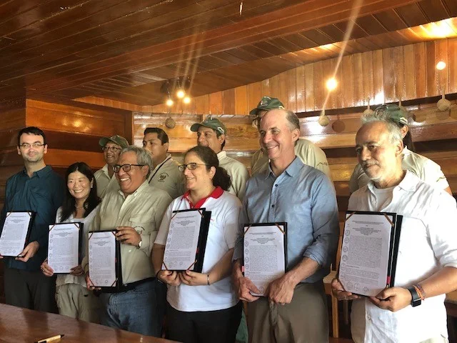Key decision makers with the signed agreement in Peru.