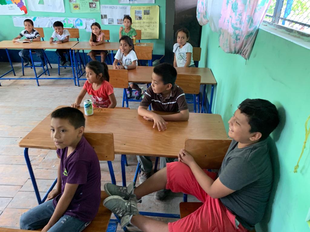 Children at the local school at Uaxactun. A year ago, the same classroom was devoid of desks.
