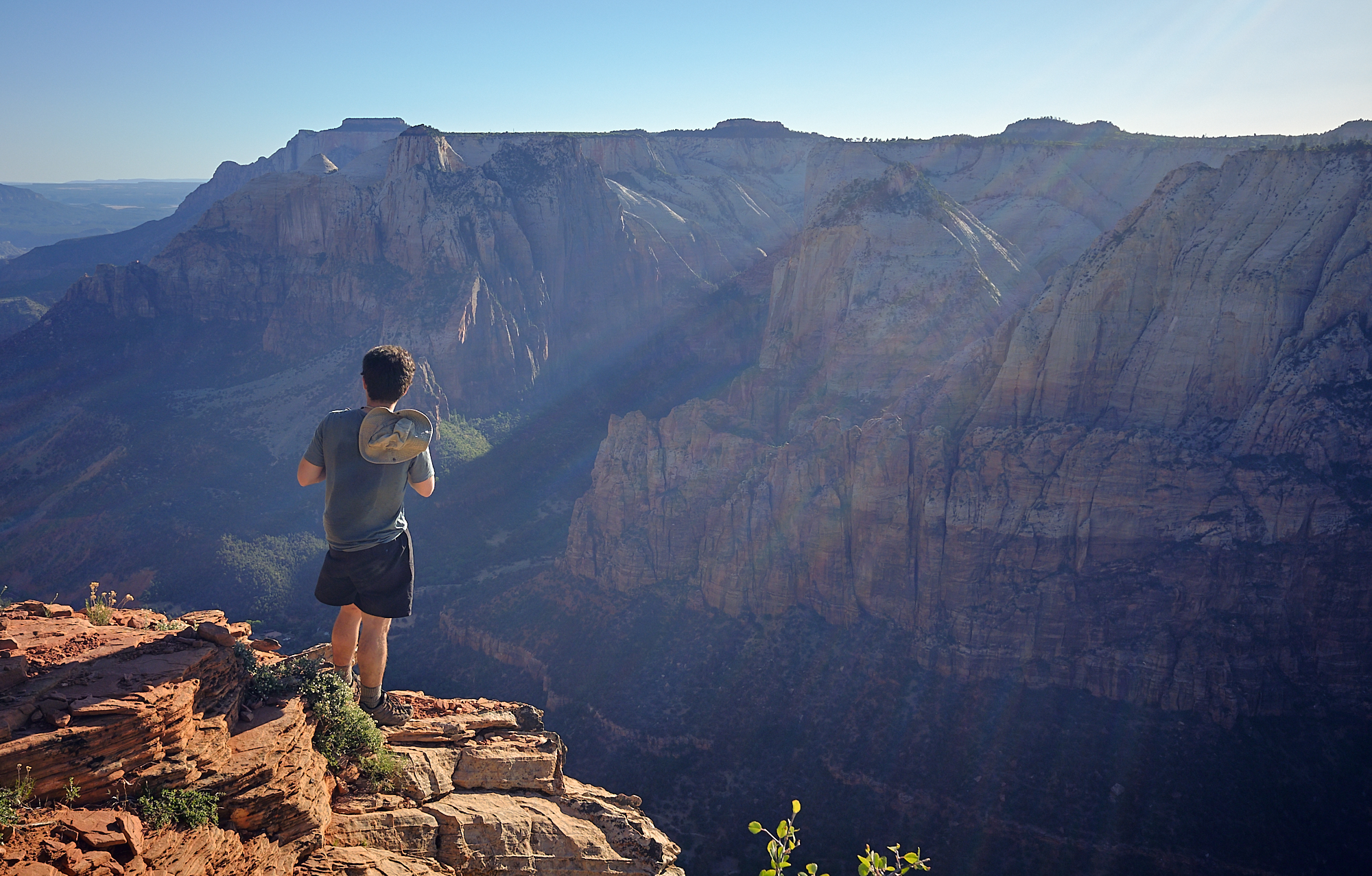  Alex stands on the rim as the sun dips below the opposite canyon wall. | Zion National Park, UT 6/3/18 