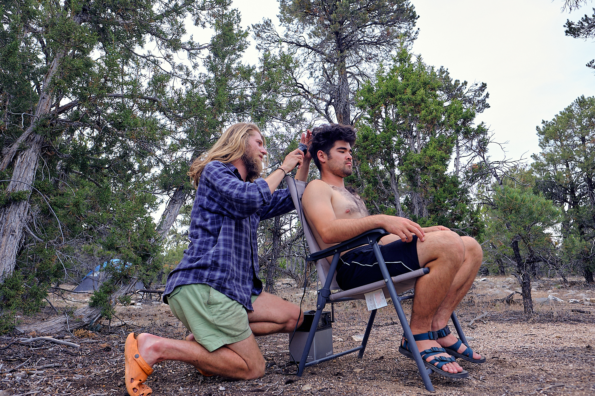  Alex gets a haircut from me. It was the first haircut I've given, and it was powered by the sun. | Great Basin National Park, NV 7/18/18 