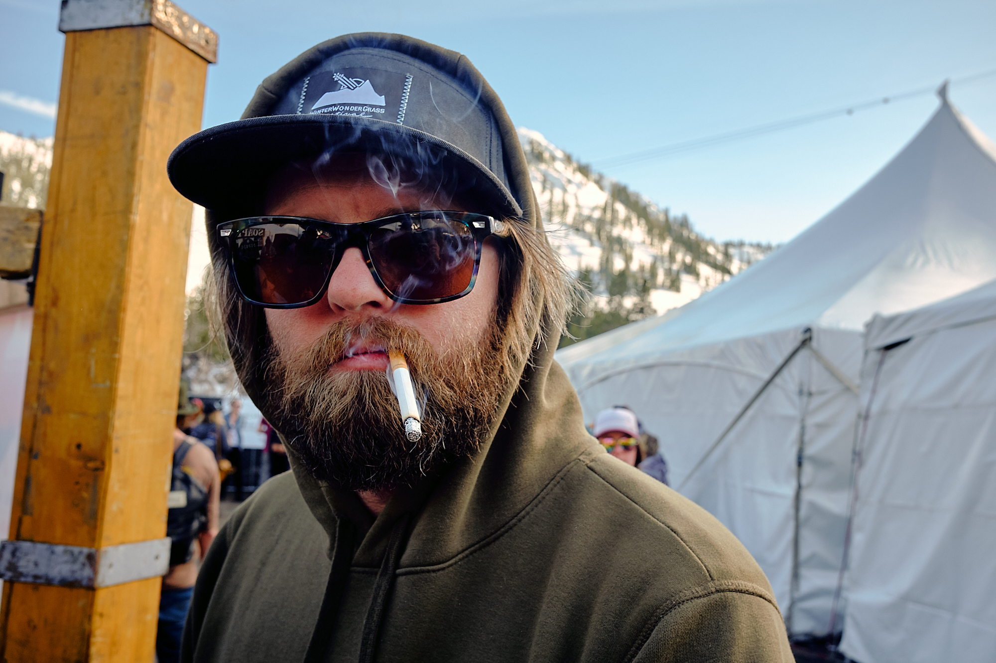  Jay enthusiastically smokes a cigarette at Winter Wondergrass bluegrass festival. | Squaw Valley, CA 3/31/19 