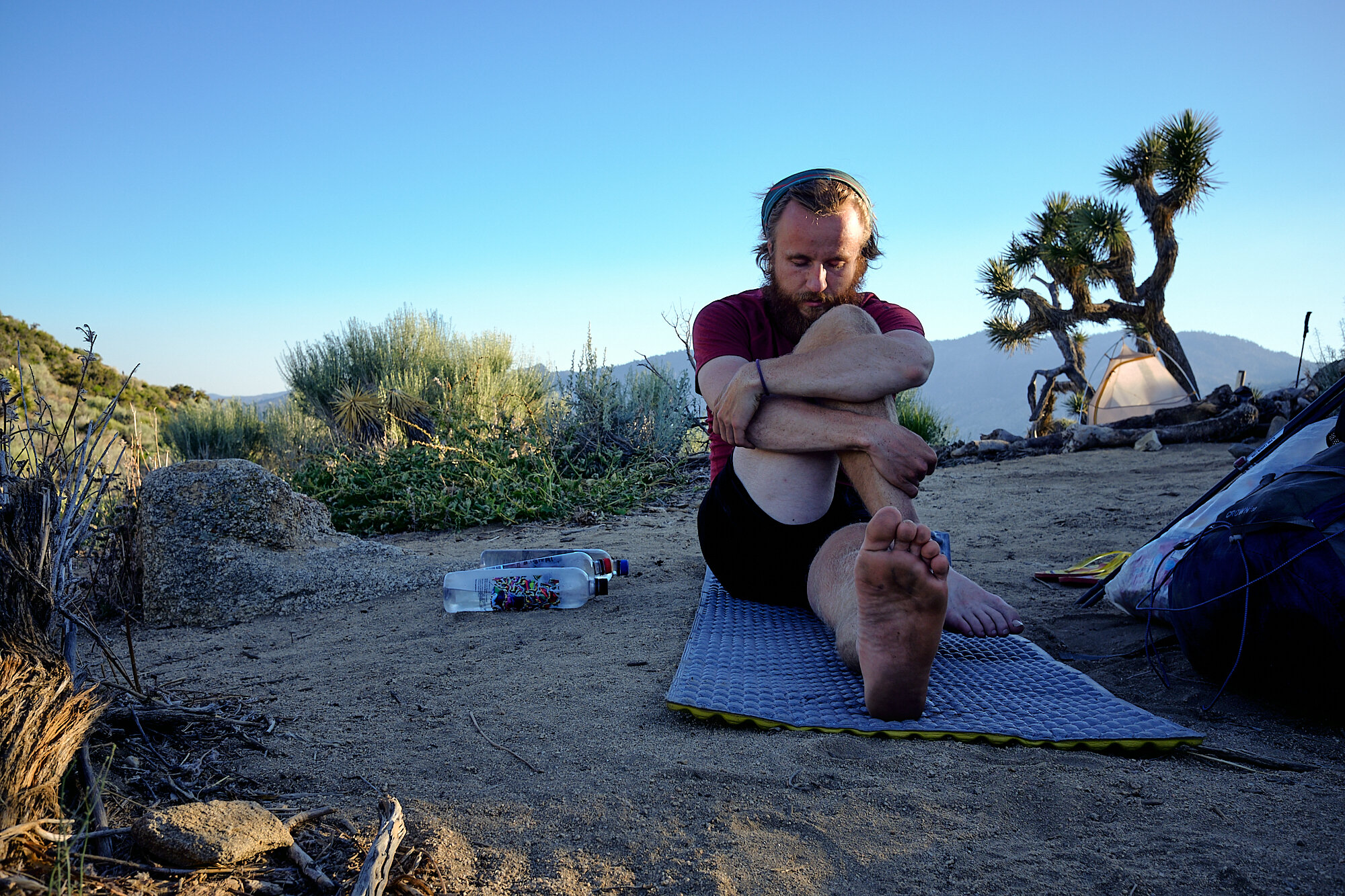  Lebowski runs through his post-hike stretch routine in camp at a water cache. | 6/13/19 Mile 617.8, 4,954' 