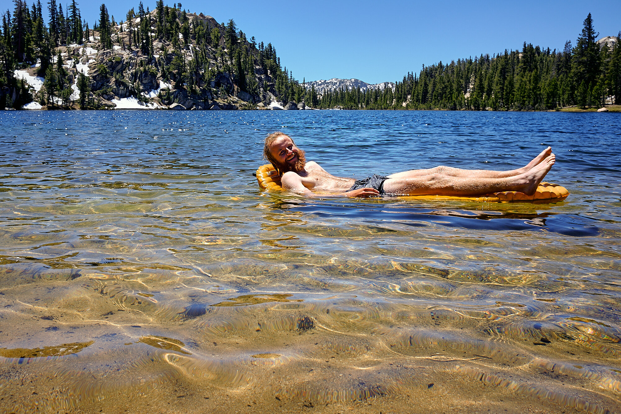  Lebowski enjoys Miller Lake from the comfort of his sleeping pad. | 7/11/19 Mile 959.8, 9,486' 