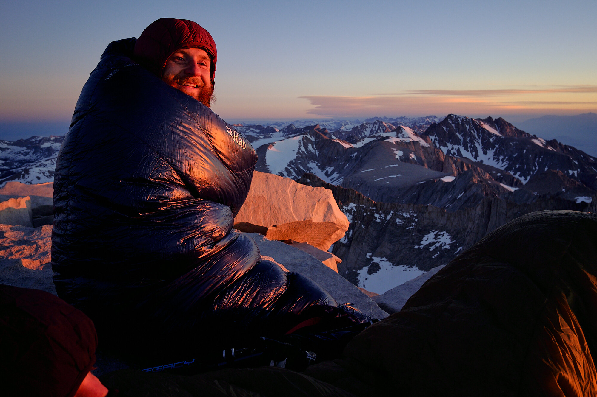 Lebowski enjoys the warmth of the first rays of sun atop Mt. Whitney. | 6/26/19 Mile 767.0, 14,504' 