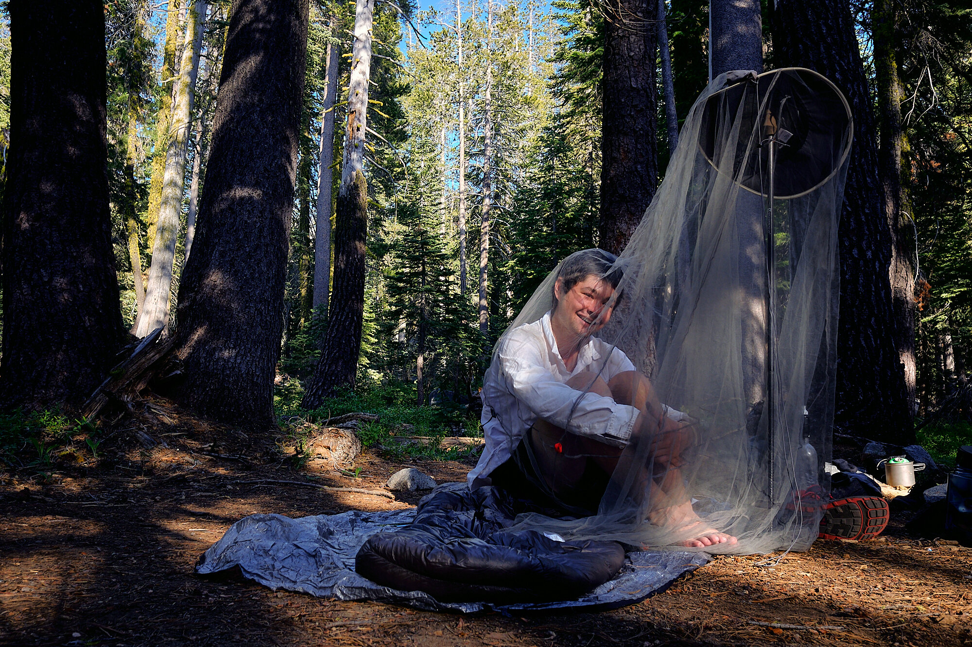  Blade attempts to outsmart the mosquitos with a makeshift net in Desolation Wilderness west of Lake Tahoe. | 7/19/19 Mile 1,122.1, 6,973' 