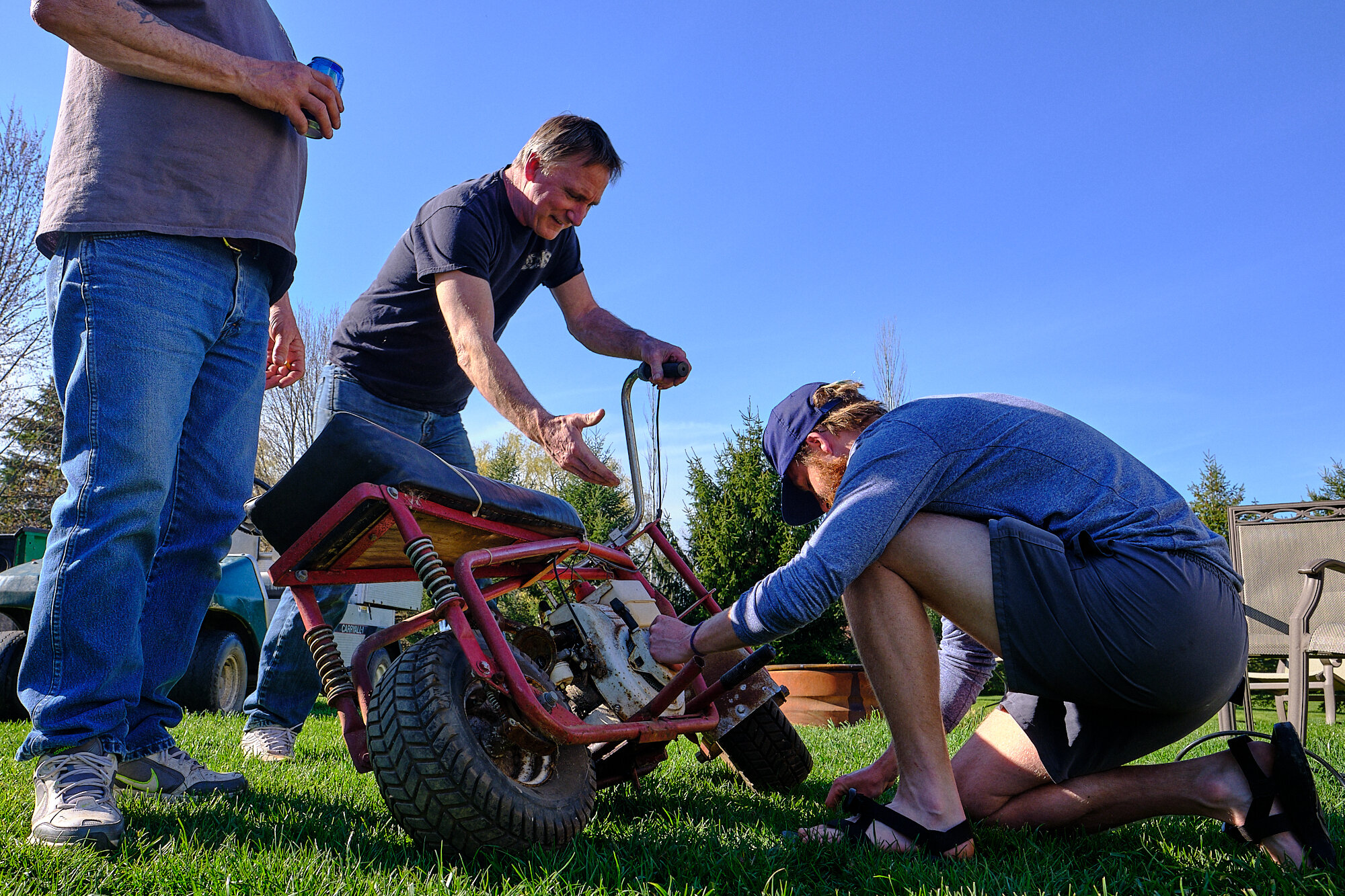  Lebowski tinkers with a minibike he rebuilt for our backyard enjoyment. | 5/2/20 Ann Arbor, MI 
