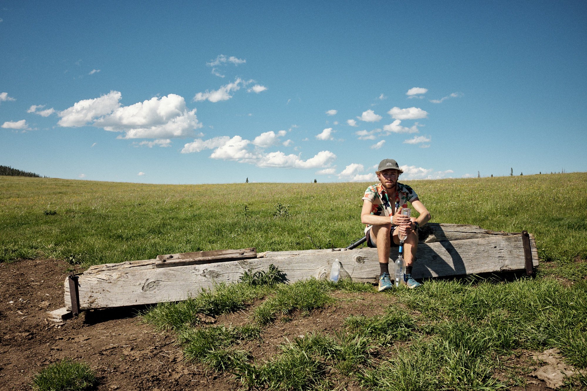  An exhausted Dig filters water at a cow trough fed by Dana Spring. | Helena National Forest, MT 7/12/22 Day 21 