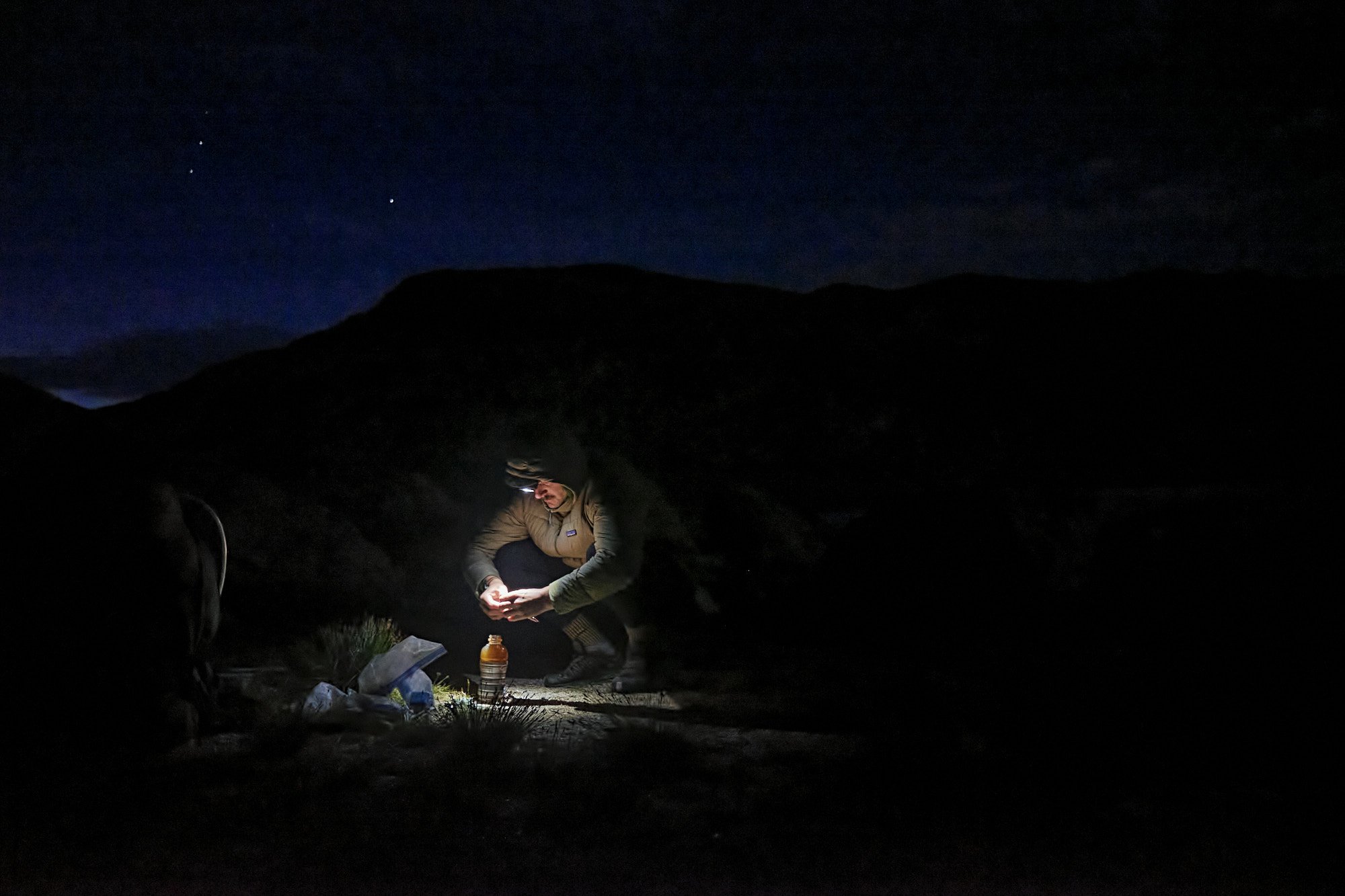 Dale whips up some cold coffee during an alpine start. We had to get most of our distance done before 12:00 since the afternoon thunderstorms were sketchy at best, and just made for a miserable time. | Wind River High Route, WY 8/13/22 Day 53