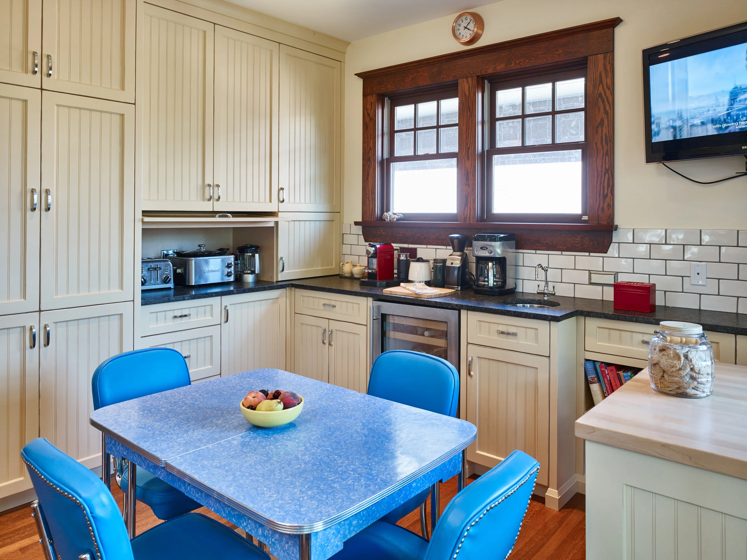 A fully redesigned kitchen with a brand new prep area. Period appropriate bead board pantry, wet-bar, a refreshments refrigerator and revived arborite table set make this work area also a great entertaining space as well. 