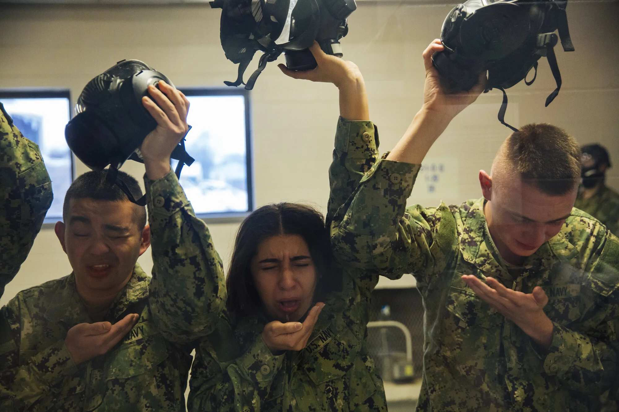  Recruits remove their gas masks inside the Òconfidence chamberÓ at Naval Station Great Lakes on Wednesday Feb. 12, 2020 in North Chicago, Ill. For a training exercise, recruits remove their gas masks and are exposed to CS gas for 18 seconds. CREDIT: