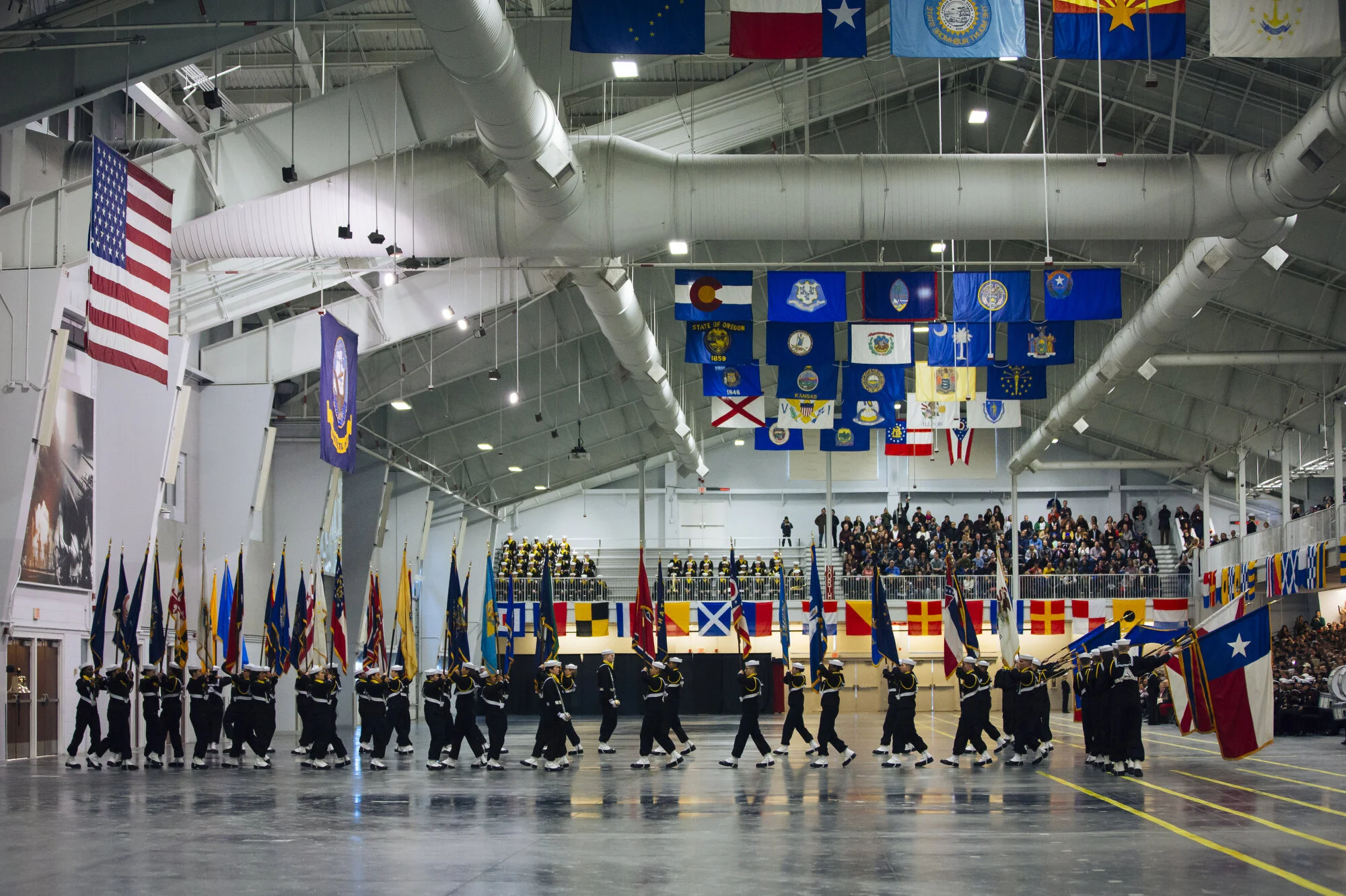  The color guard carries flags from all 50 states during graduation at Naval Station Great Lakes on Friday Feb. 14, 2020 in North Chicago, Ill.CREDIT: Taylor Glascock for The Wall Street JournalCSBOOTCAMP 