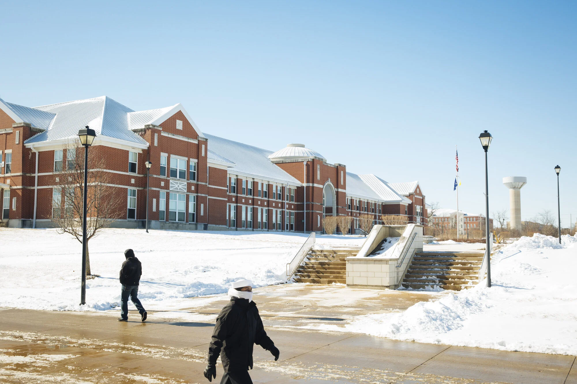  People walk past the administrative building at Naval Station Great Lakes on Friday Feb. 14, 2020 in North Chicago, Ill. CREDIT: Taylor Glascock for The Wall Street JournalCSBOOTCAMP 