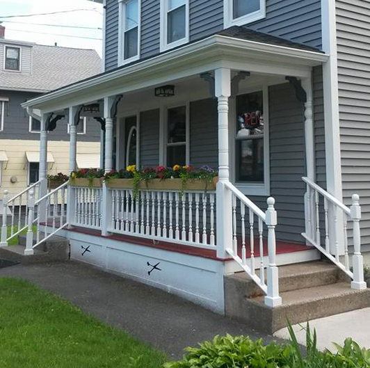  Custom porch, railings and stairs for this local business, by Greniers Home Improvement. 