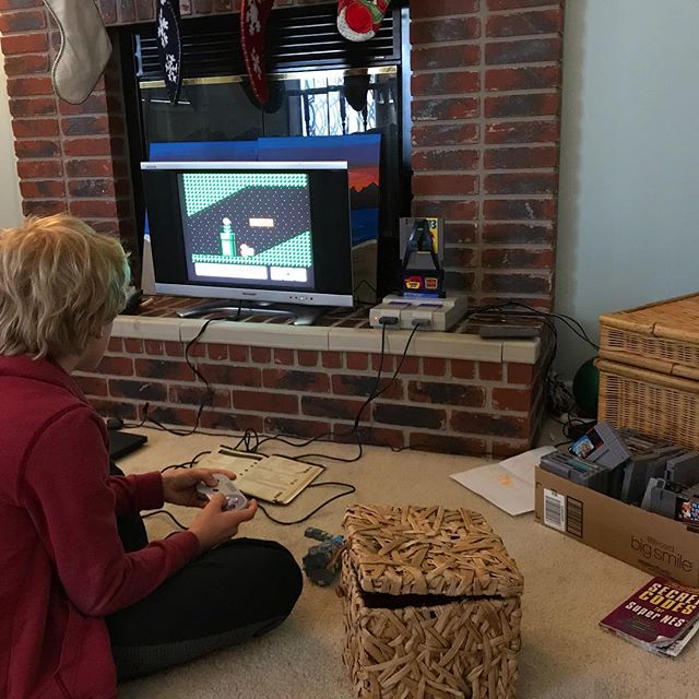 Snow day update: Playing classic Nintendo while dad works out of frame.