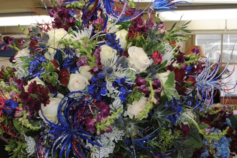 An arrangement created by Laura Dowling at The White House in which I painted and glitterd succulents for the 4th of July!