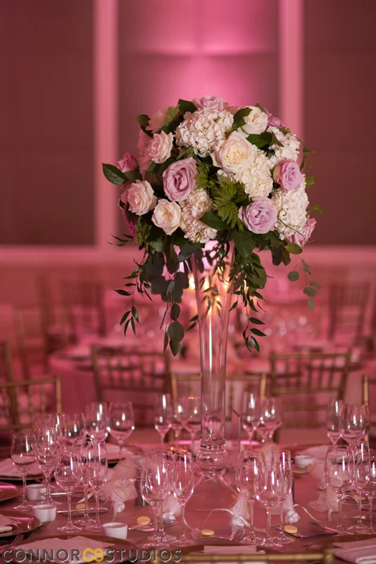 These flowers could be described as roses and hydrangea in rounded style with trailing greenery. All photos by Connor Studios