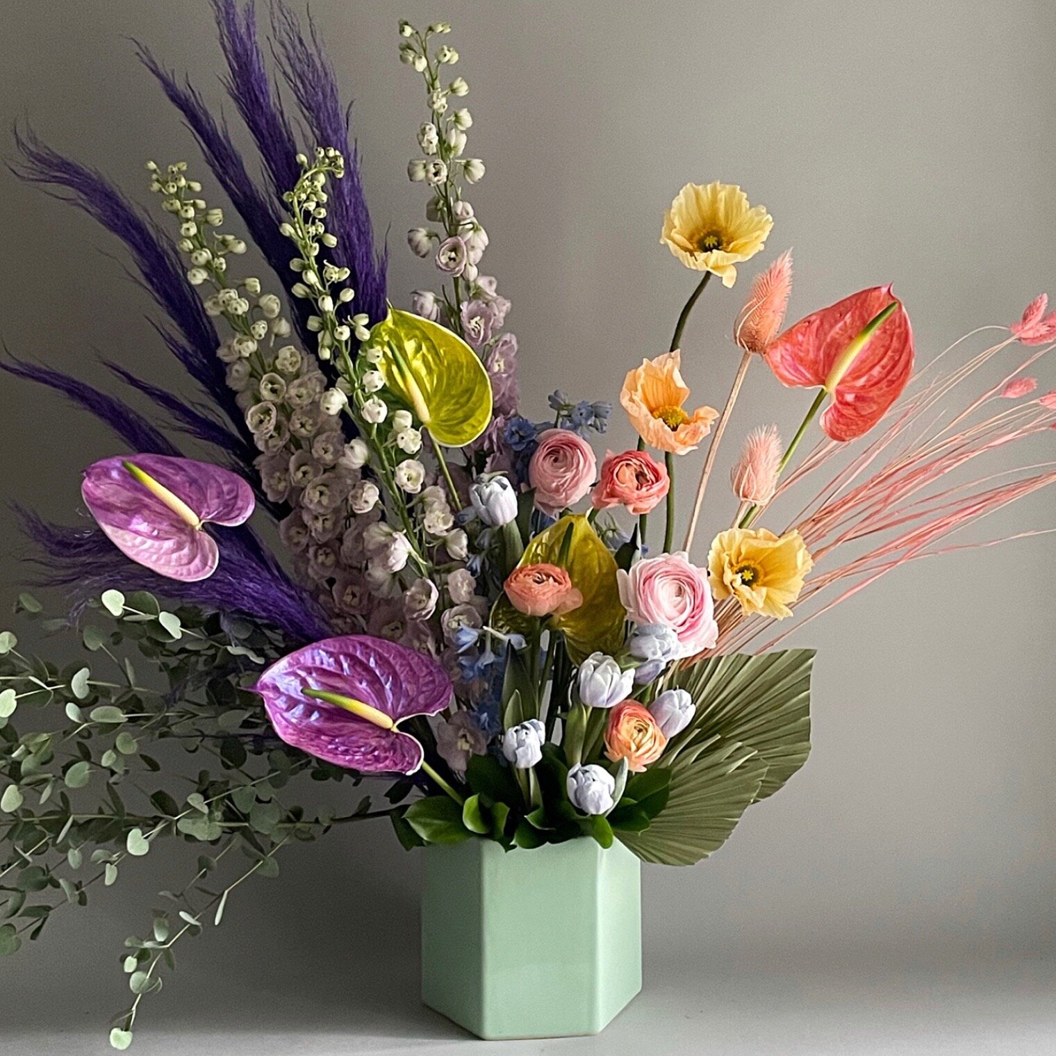  Rainbow Bouquet, anthurium, delphinium, pampas grass. 