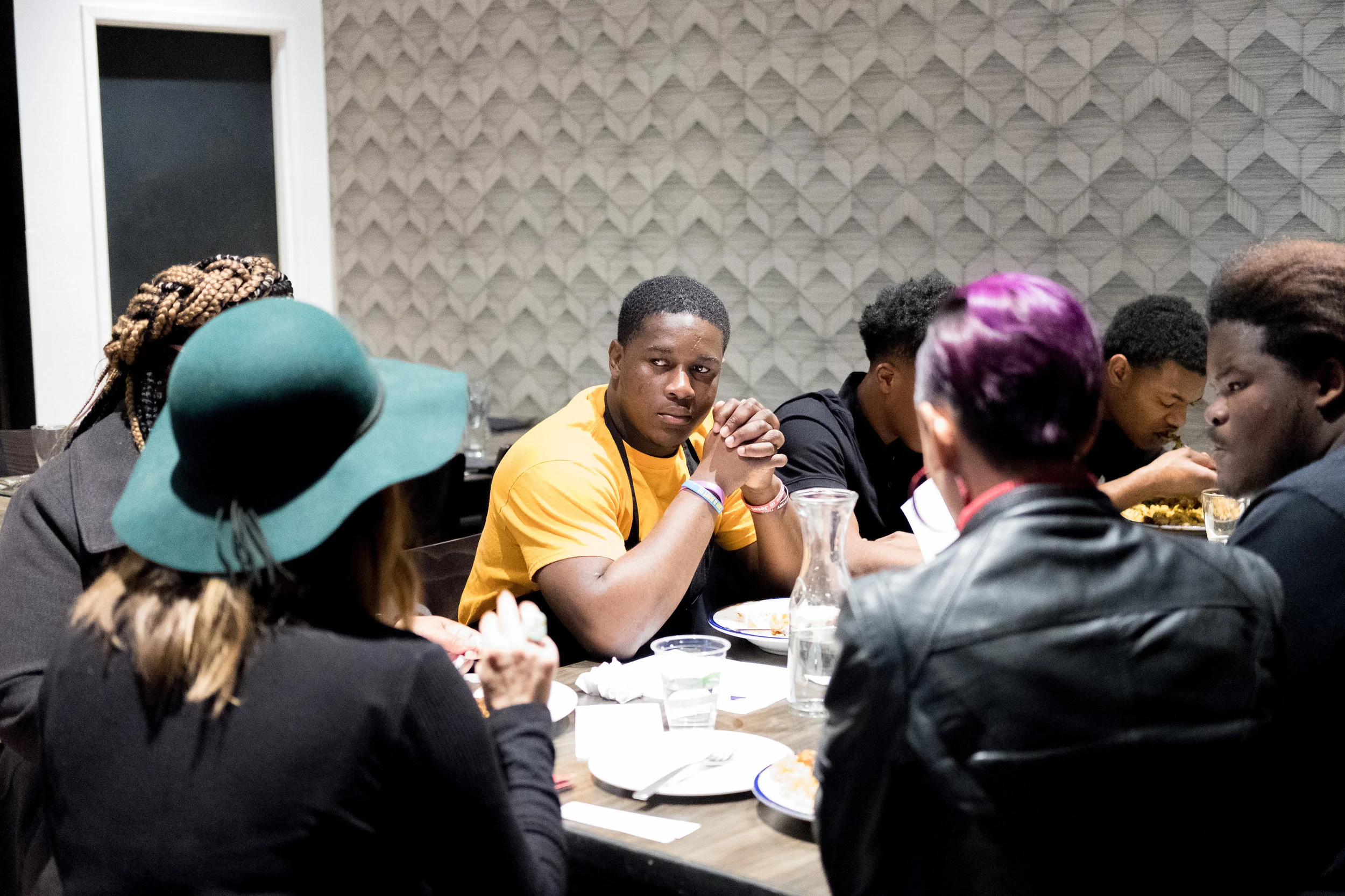 Café Momentum interns meeting with staff social workers.