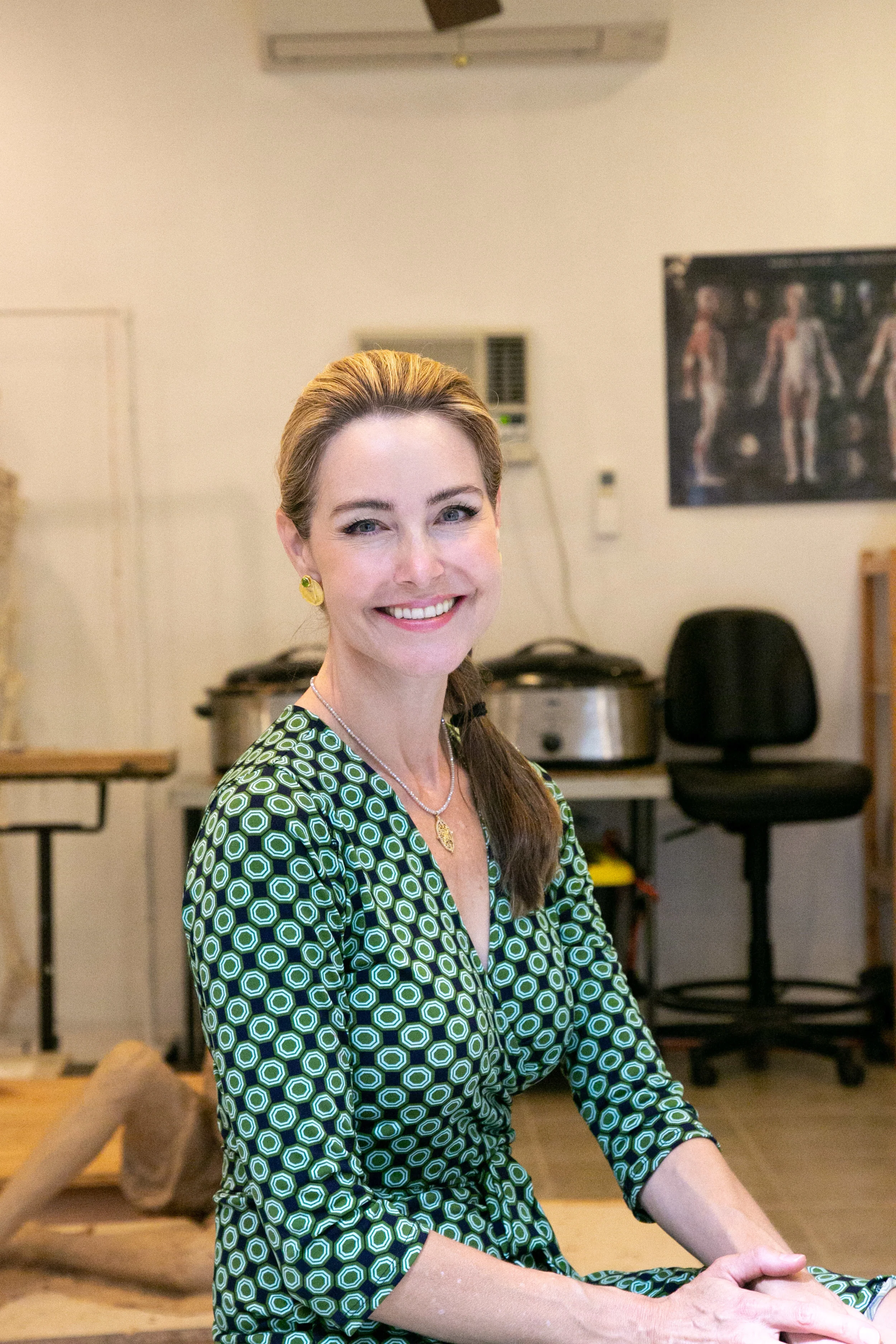 Angela Mia De La Vega in her backyard studio space.