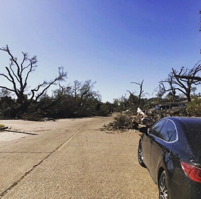  "Our once beautiful tree lined street. The National Weather Service told us that we were the worst house in the tornado's path. There are houses behind all of that debris" says Elizabeth. 