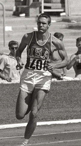Ed Young running in the 1960 olympic games.