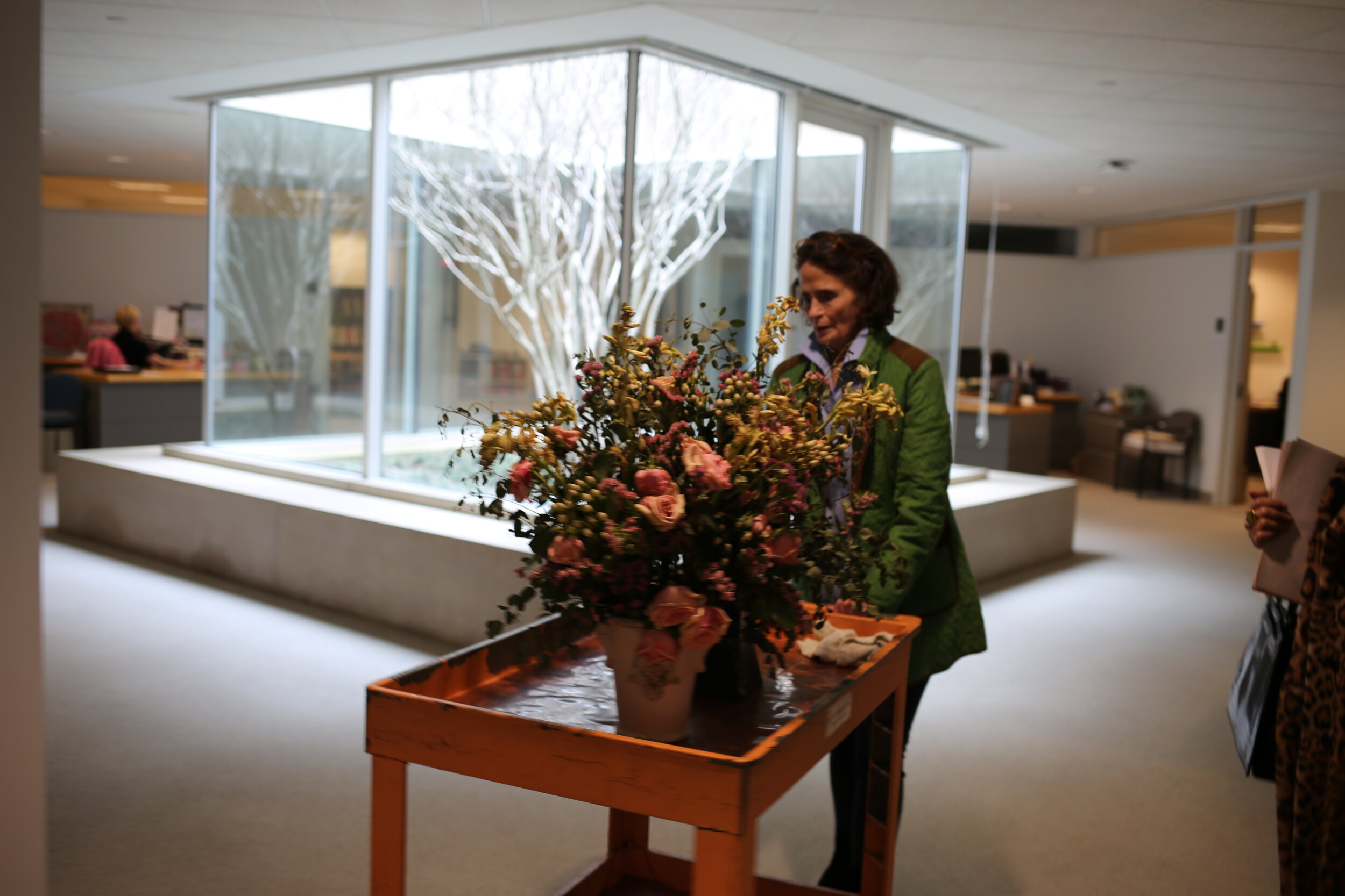 Katherine removing the floral arrangements from last week to make room for the festive Valentine week creation.