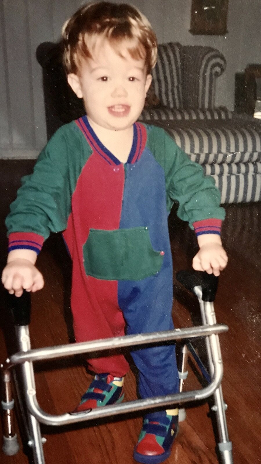 Parker started walking with a walker at the age of two. By 3 /12 he was walking on his own.