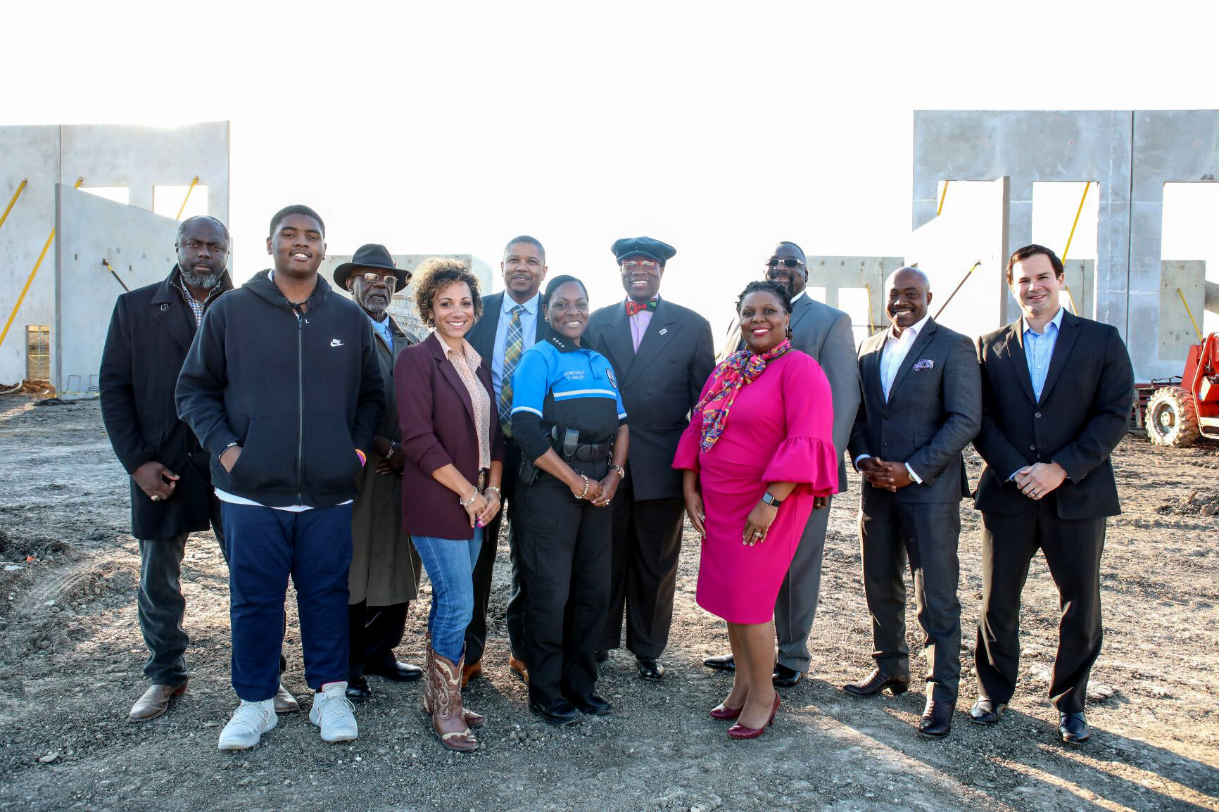 Kimberly Shaw, in cowboy boots, with the RBCA team and partners at the ground breaking of the new South Dallas County Government Center in 2019.