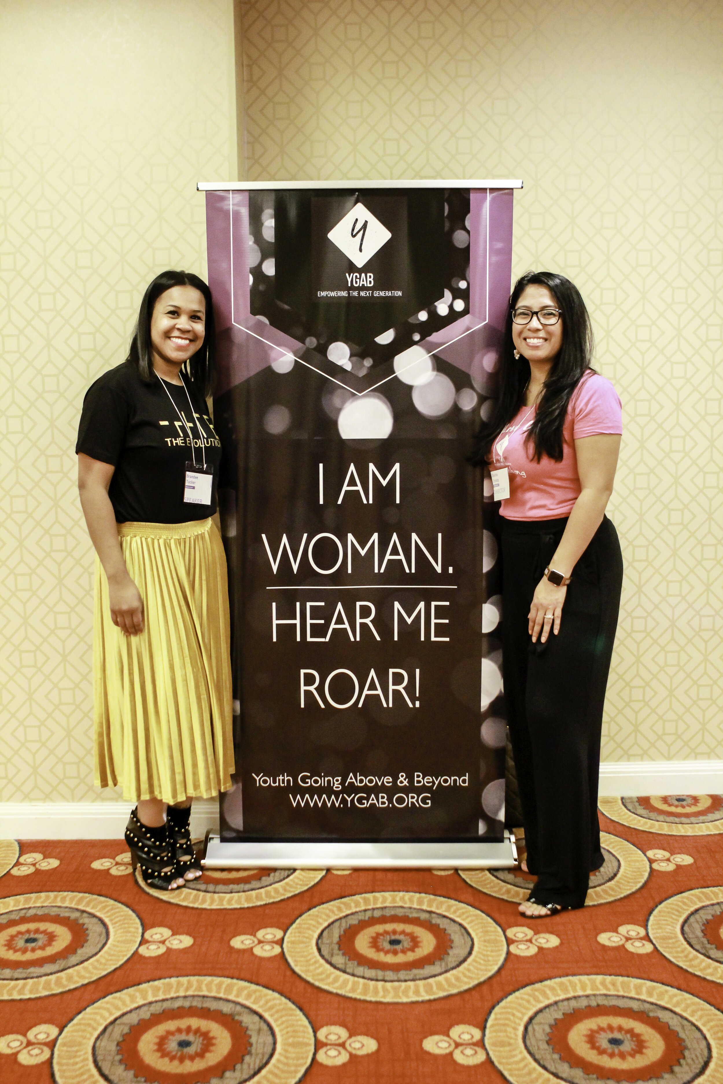 Dasha Crosby (right) with Brandee Tucker, Founder of The Evolution Group (left), at a Youth Going Above &amp; Beyond Event in 2019. Photo by The LABP Lens.