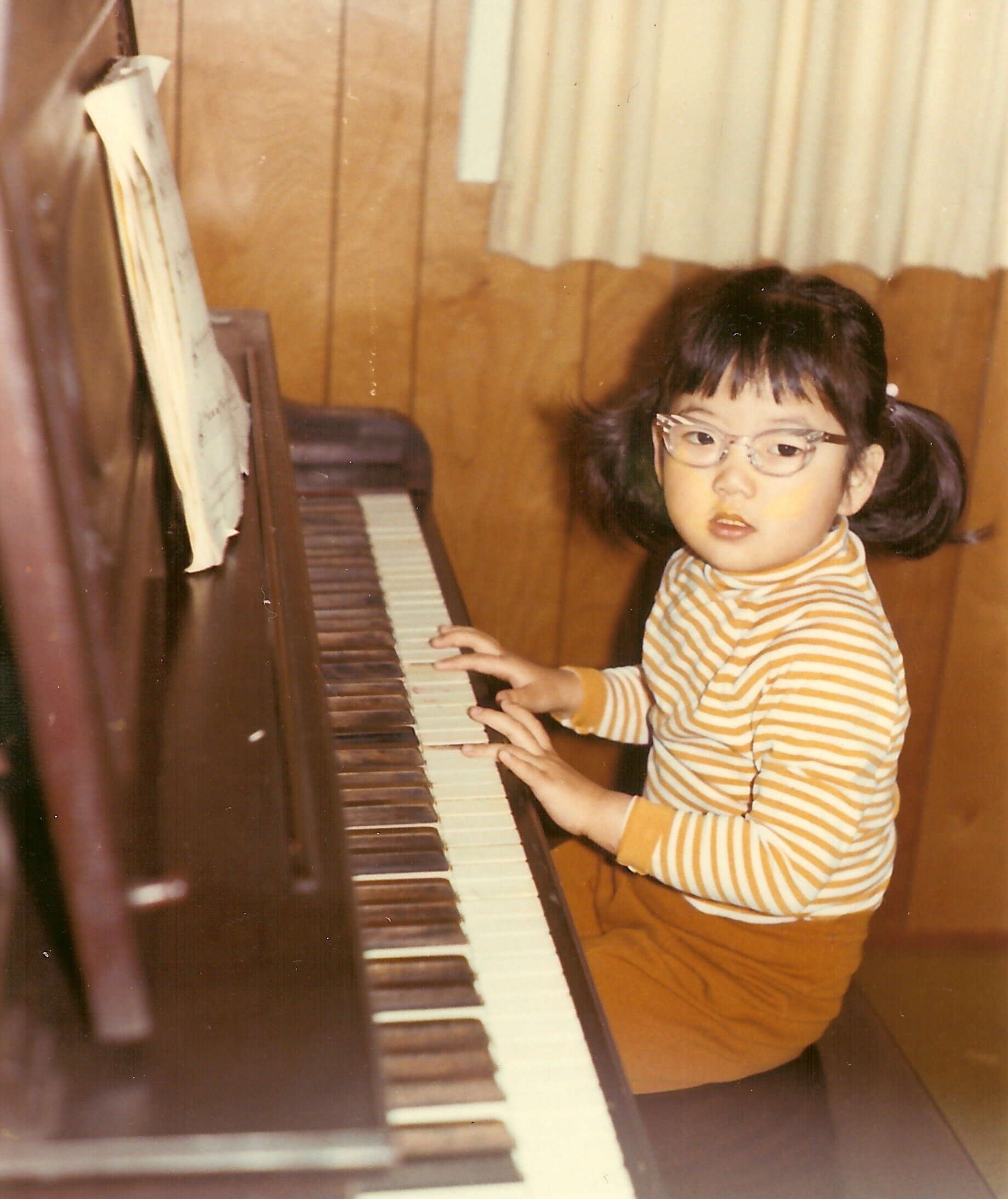 Anne at her childhood piano.