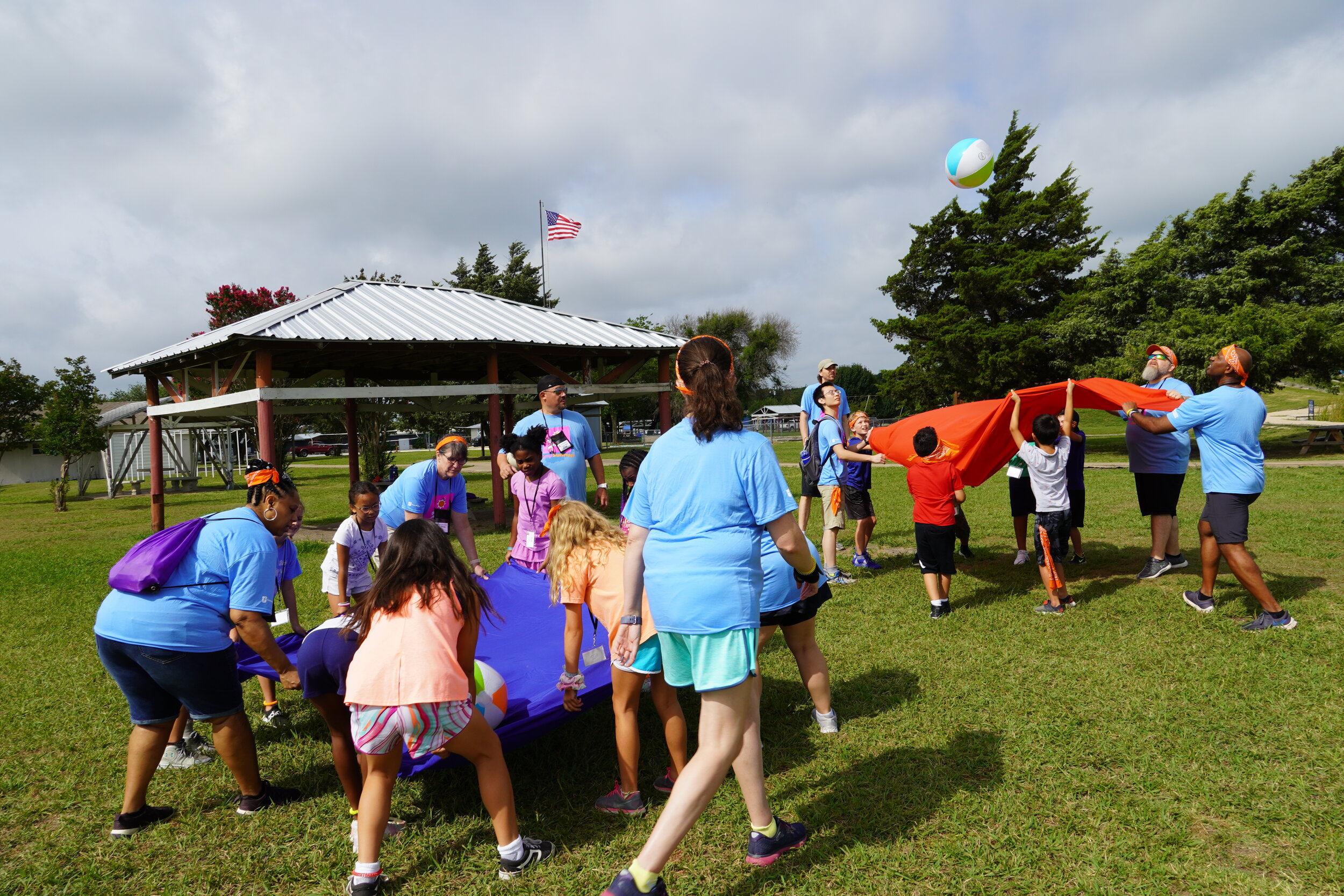  Volunteers play games with the children that help them in processing their loss. A beachball with different words such as sad, angry, and hopeful is tossed in the air. Whatever word it lands on, the campers tell what the word means to them. It opens