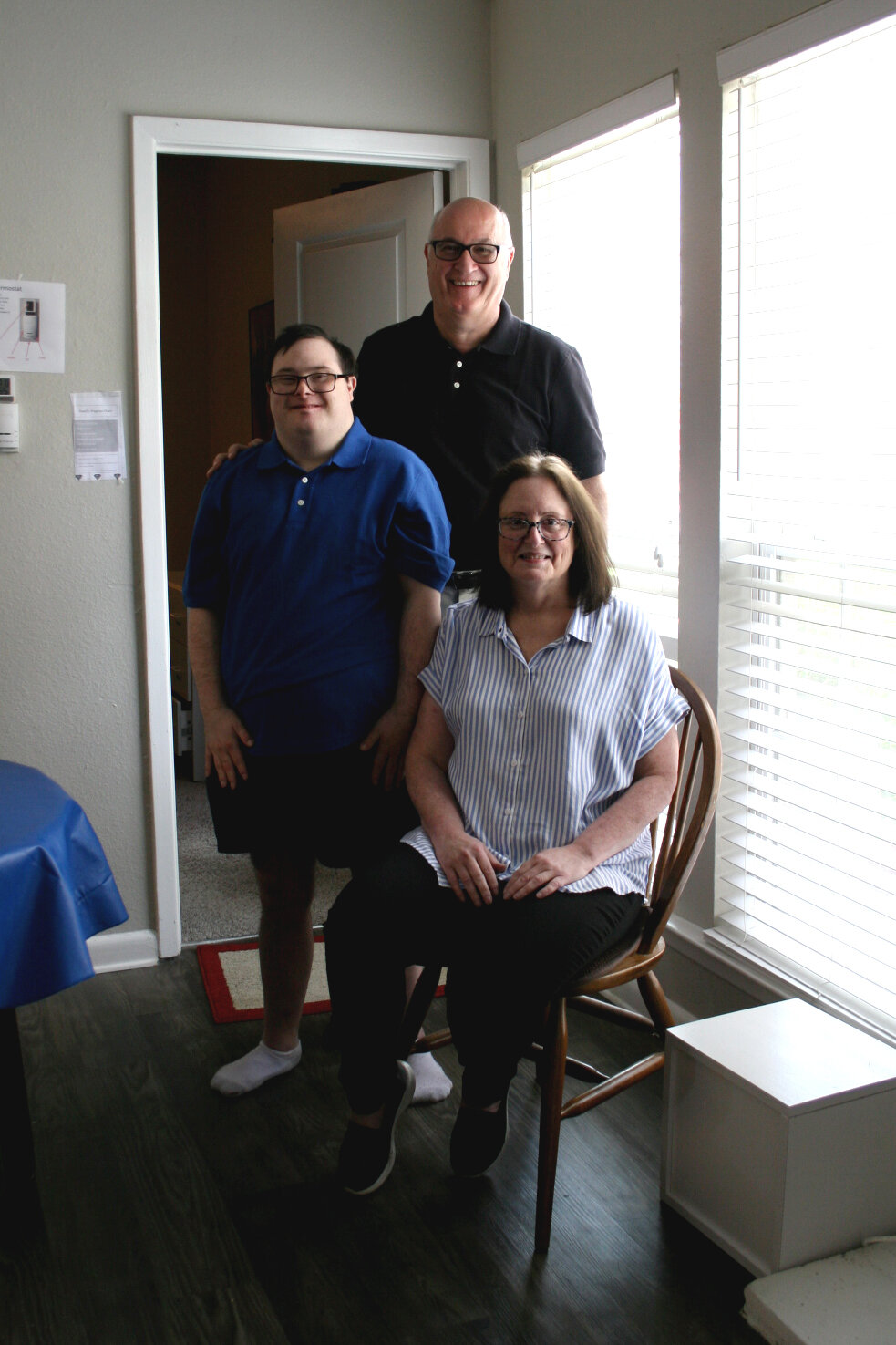 David with his dad, Jim, and mom, Robin at his apartment in Plano.