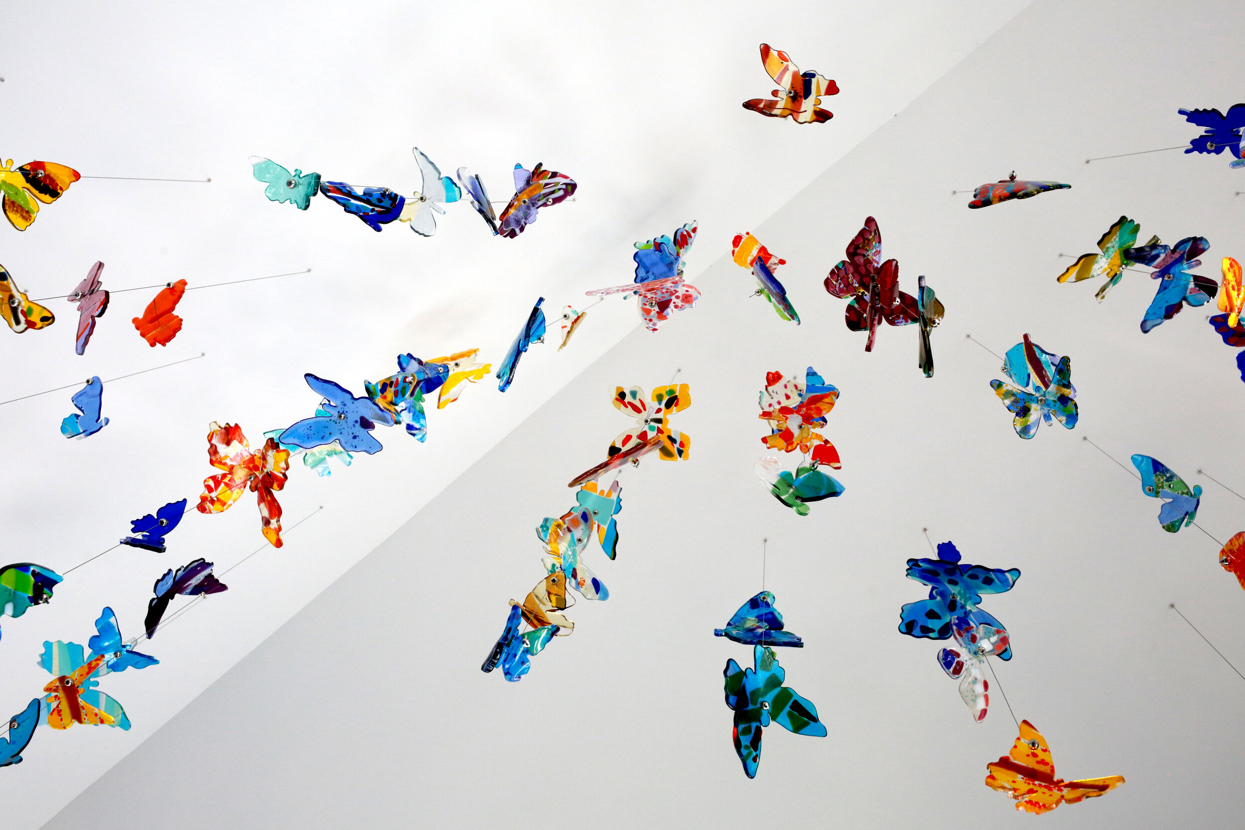 Butterfly glass installation by Carlyn Ray inside the Ronald McDonald House of Dallas.