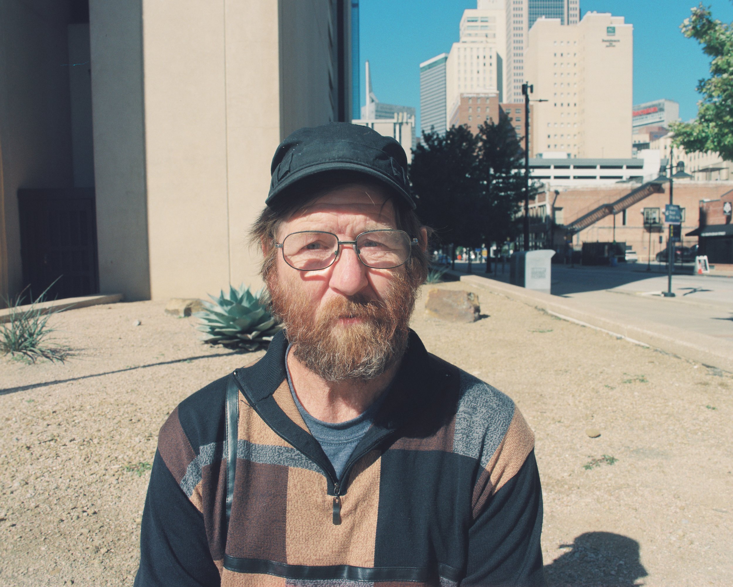  Joe, 59, is from Boston. He is actually a wandering homeless person that has been in Dallas for a few months. He's constantly on the move from city to city hitchhiking. Joe doesn't like the shelters as he doesn't like the conditions and rules. He fe