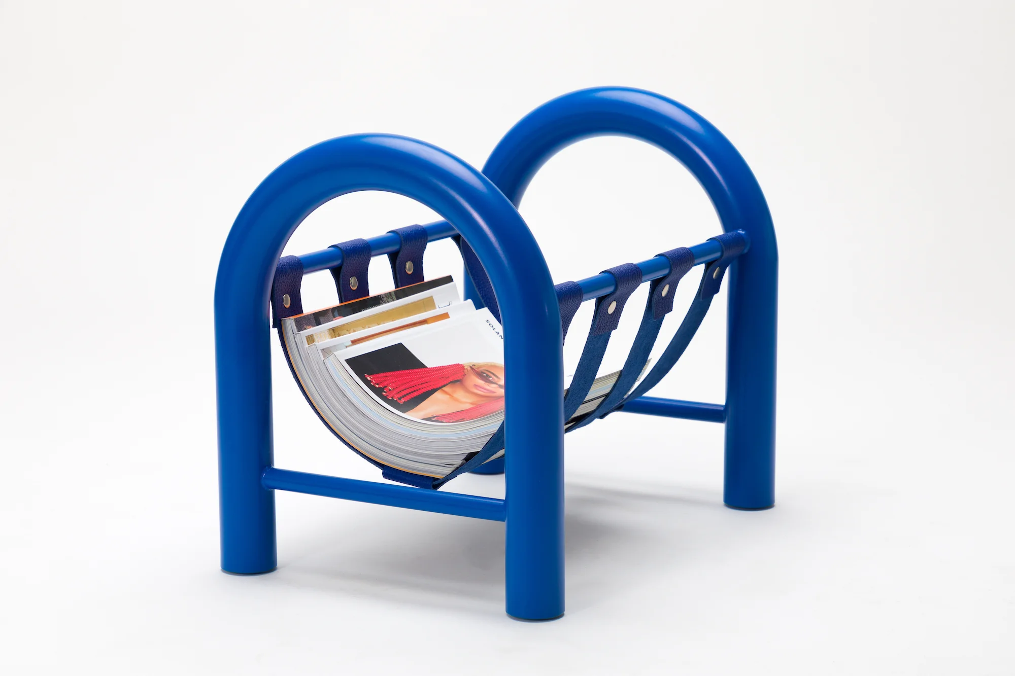 TUBULAR MAGAZINE RACK — ANOTHER HUMAN