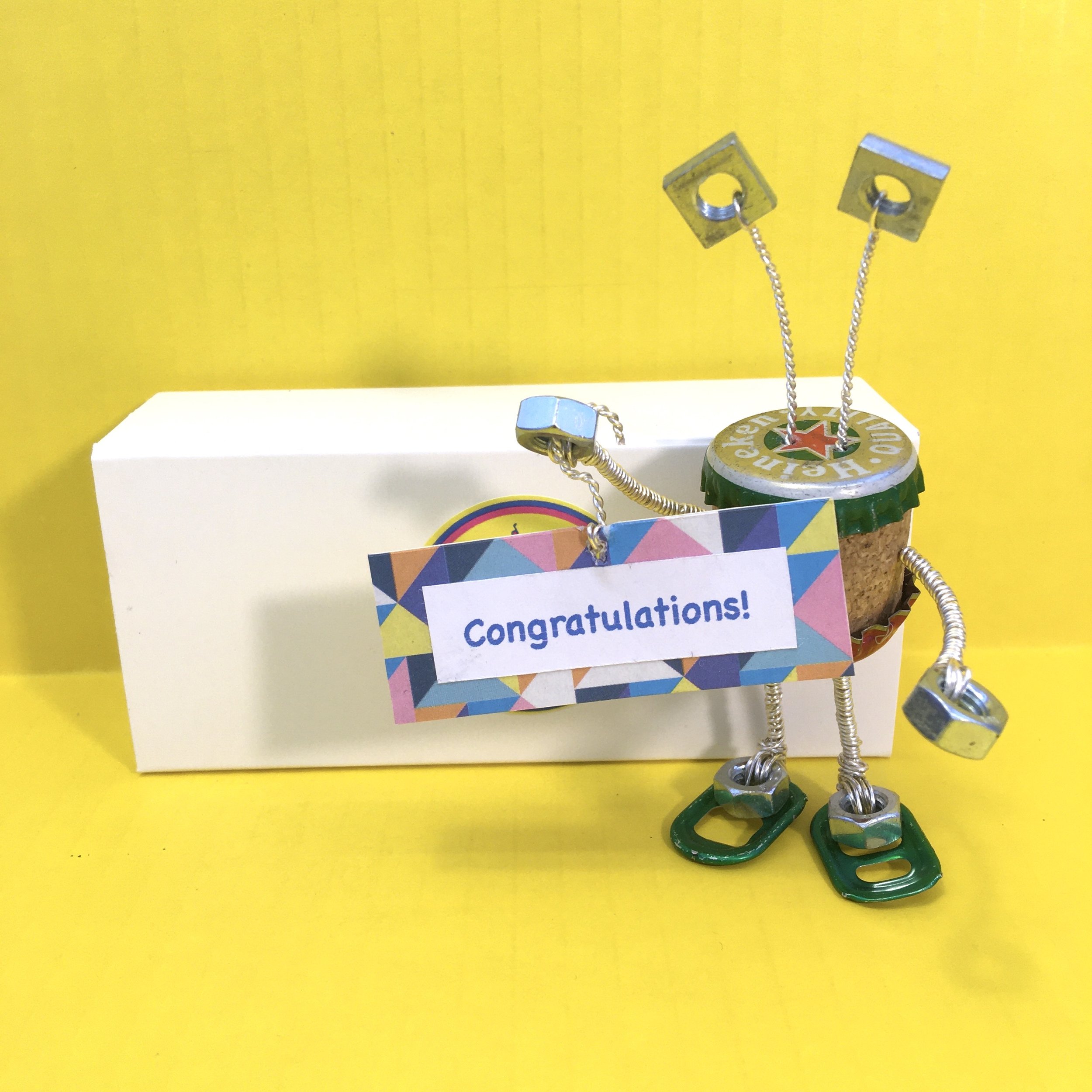 Junk Alien with Handmade Sign_Yellow Background_2.jpeg