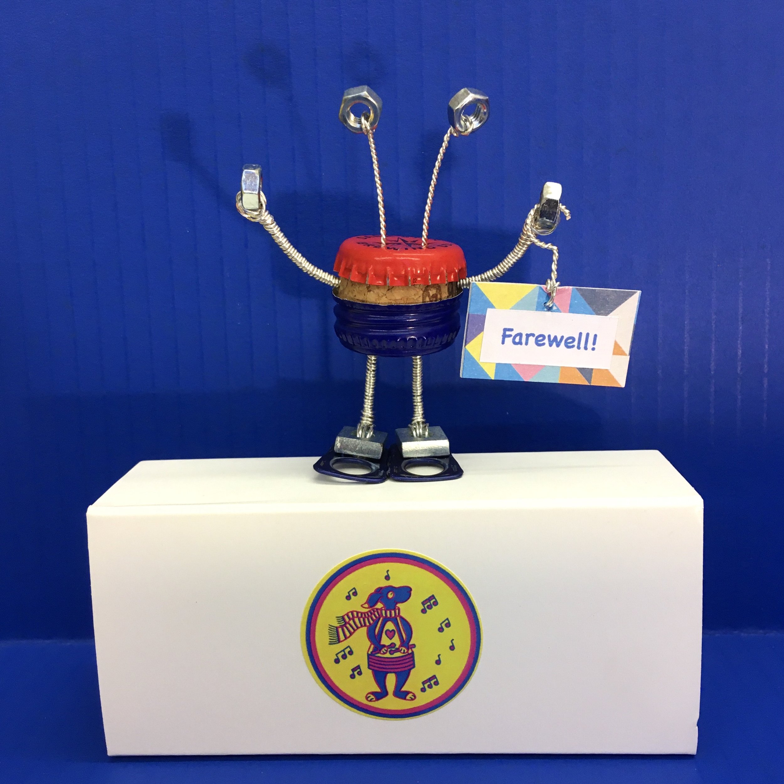 Junk Alien No. 15 - Blue background - Top of box with sign - Farewell.jpeg
