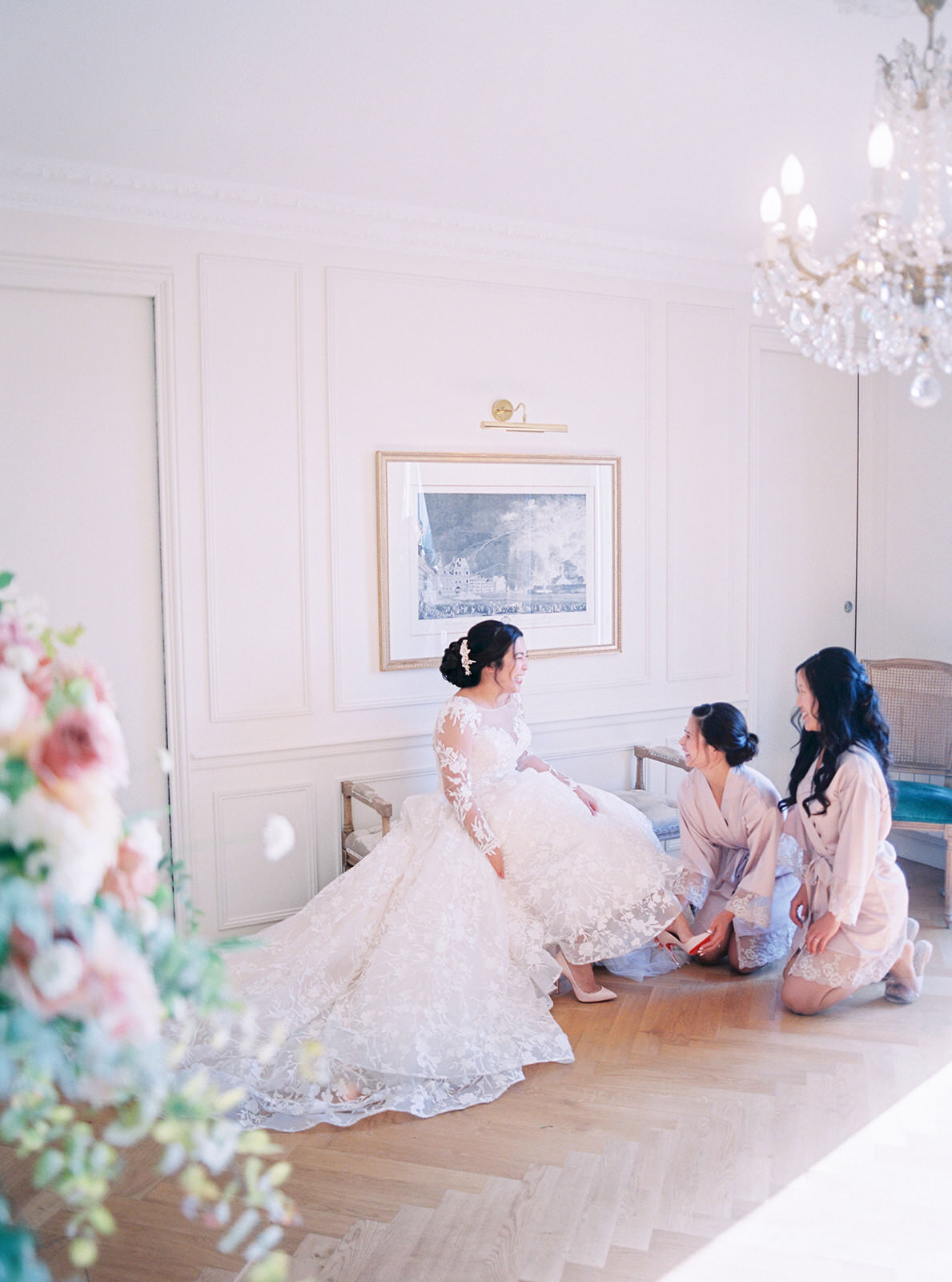  Bridesmaids helping Linda into her wedding shoes. 