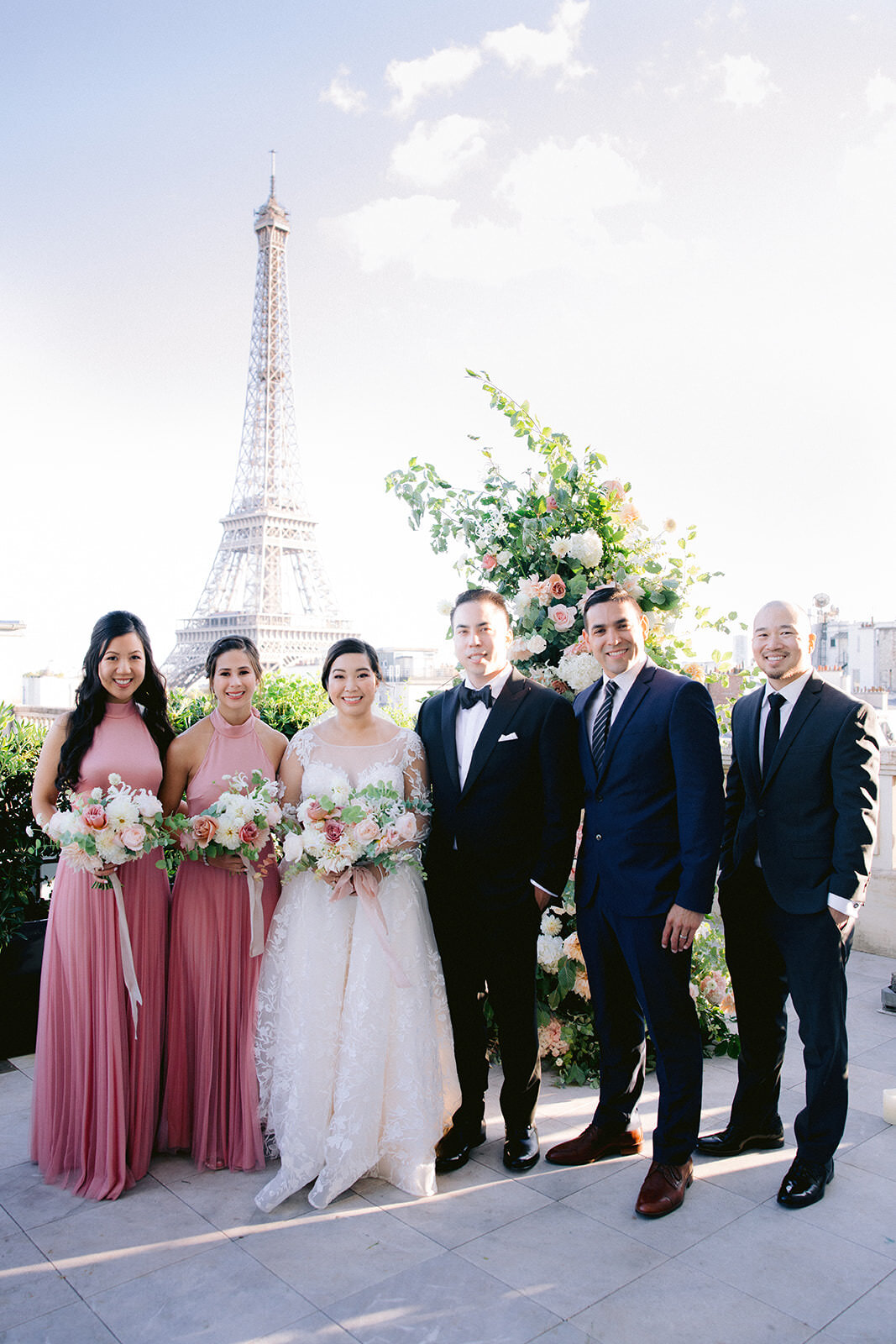  Bride, bridesmaids, groom and groomsmen after their Eiffel tower wedding Ceremony at the Shangri-La Hotel in Paris, France. 