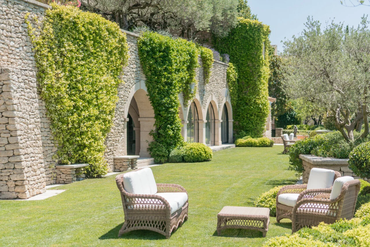 Bastide de Gordes Garden Lounge, perfect for pre-ceremony cocktails for your Provence, France Destination Wedding.Photo courtesy of Arte de Vie