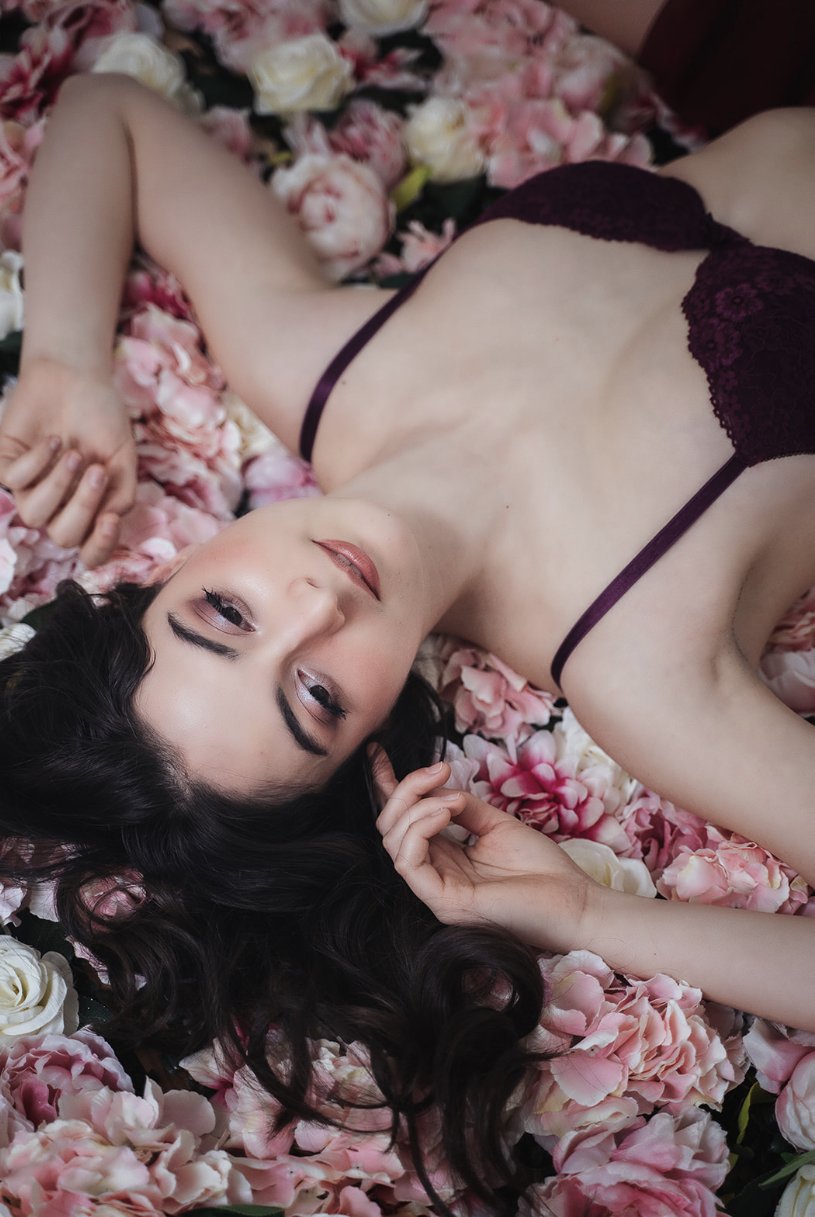  Dark hair down-do with colorful pink makeup and purple lingerie, boudoir makeup and hairstyling in Paris, France, by Onorina Jomir Beauty. 