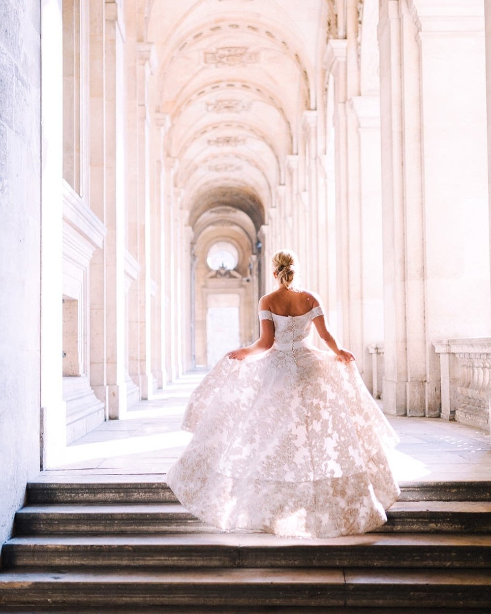 Swooning over this stunning gown, with the intricate patters shimmering gracefully in Parisian sunlight! 😍

Pair your detailed bridal gown with a minimalist updo, or polished, brushed-out waves for a classic look that will appear timeless years down