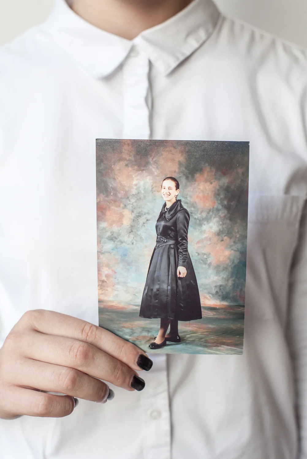 Chaya holding a picture from her religious past