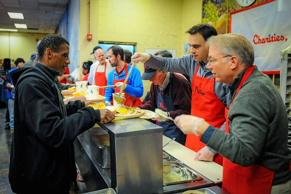 Phillies front office team serve holiday meals to over 200 guests at Our Brothers' Place