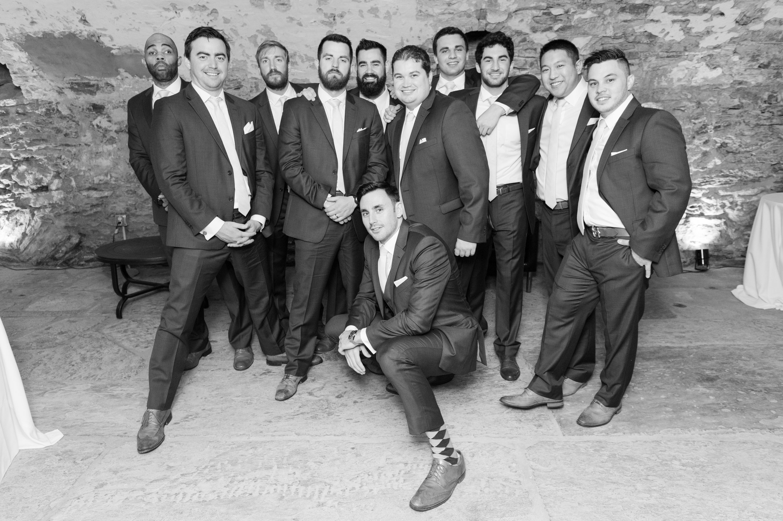Groomsmen in catacombs black and white
