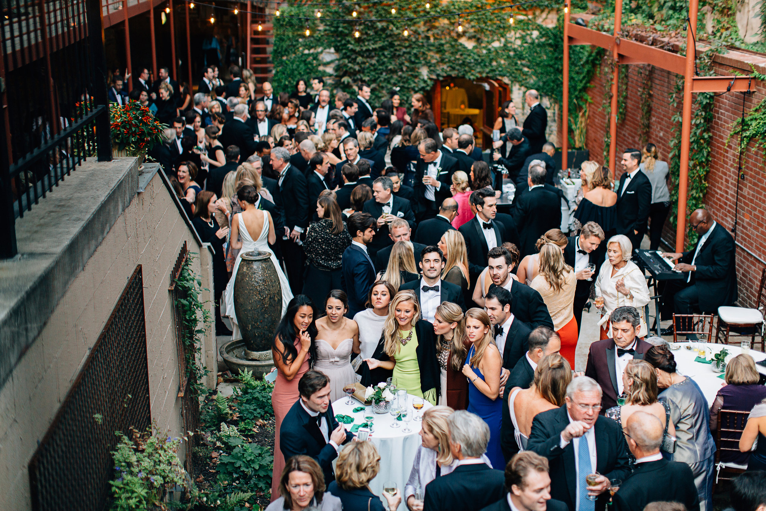 Cocktail hour wedding reception in Garden Courtyard at Excelsior