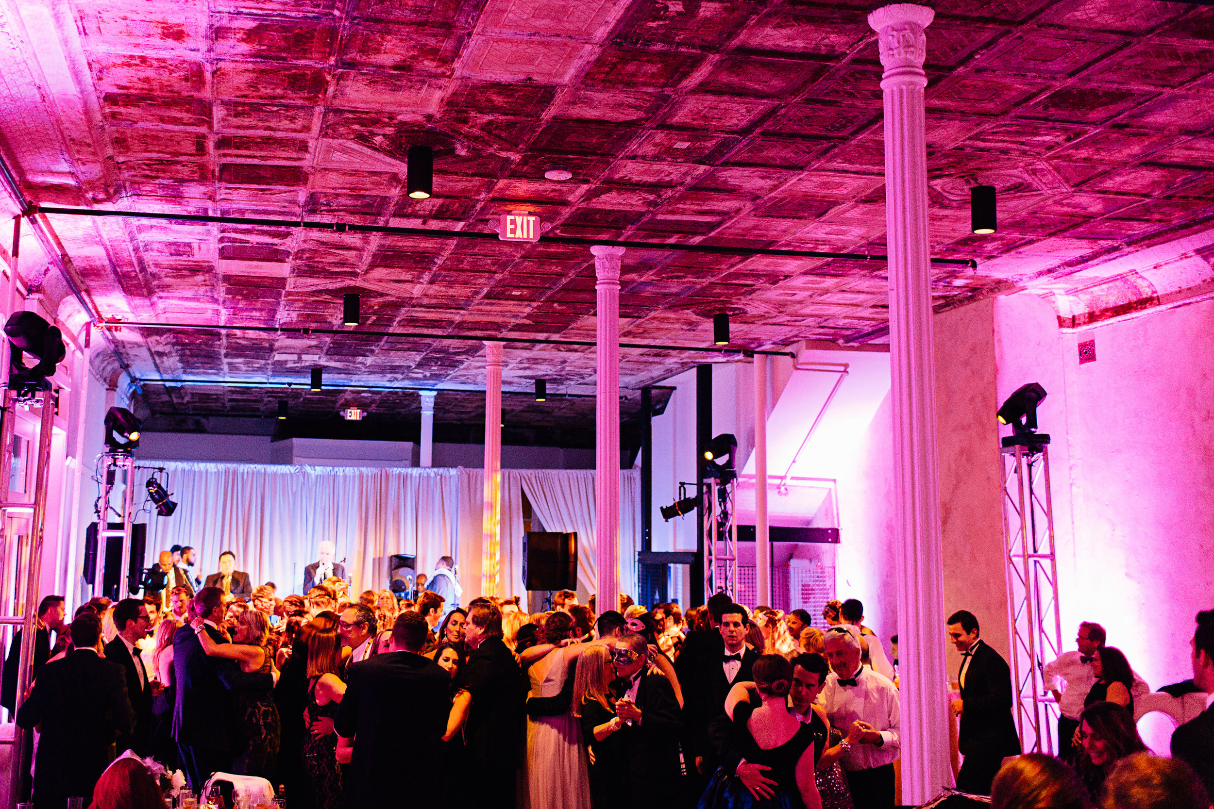 Purple lights wedding dance floor reception with DJ