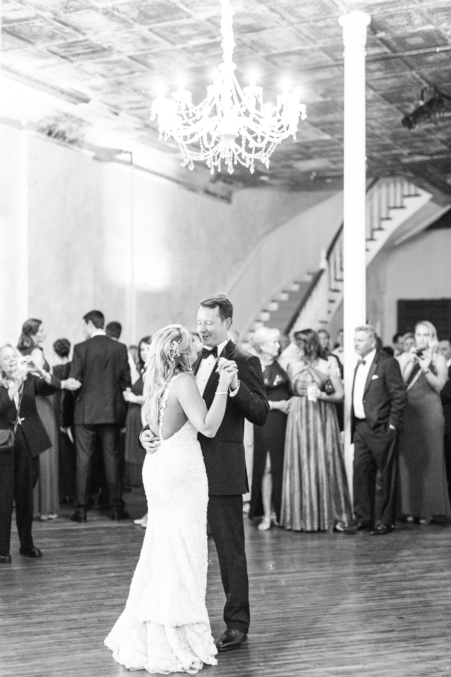 Bride and groom dancing first dance in Grand Salon of Excelsior in black and white