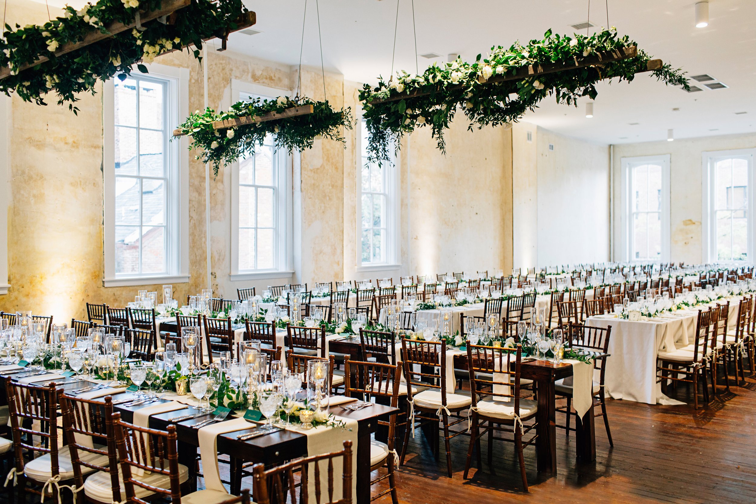 Empire Room wedding dinner set up with hanging greenery