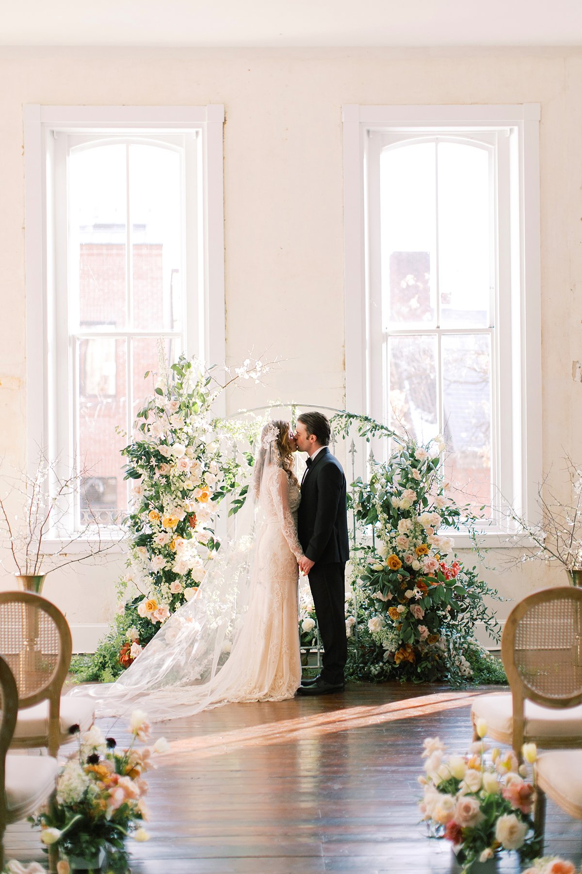 bride and groom kissing wedding ceremony in Empire Room at Excelsior